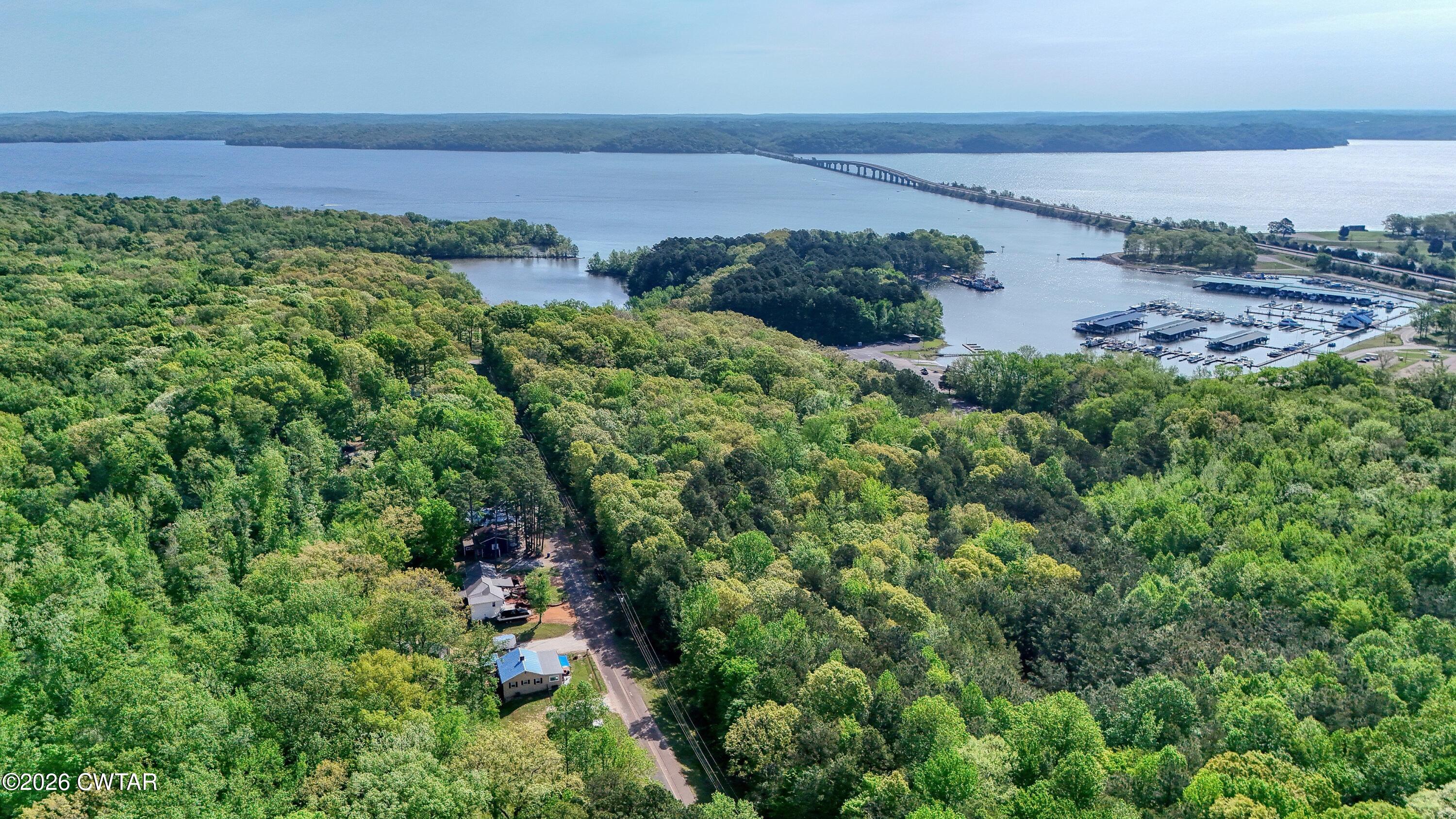 195 Coast Guard Road Buchanan, TN 38222 - Photo 33 of 34 a view of a garden with a building in the background