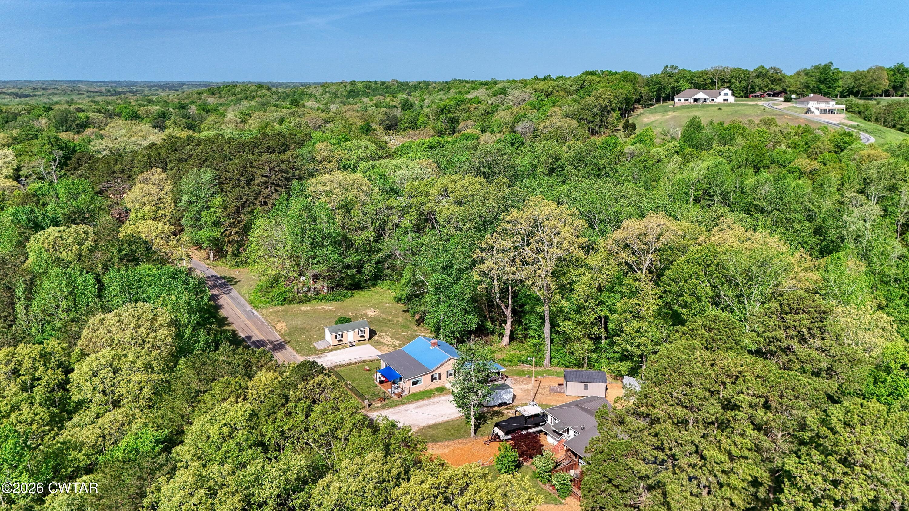 195 Coast Guard Road Buchanan, TN 38222 - Photo 34 of 34 a view of a city with lush green forest