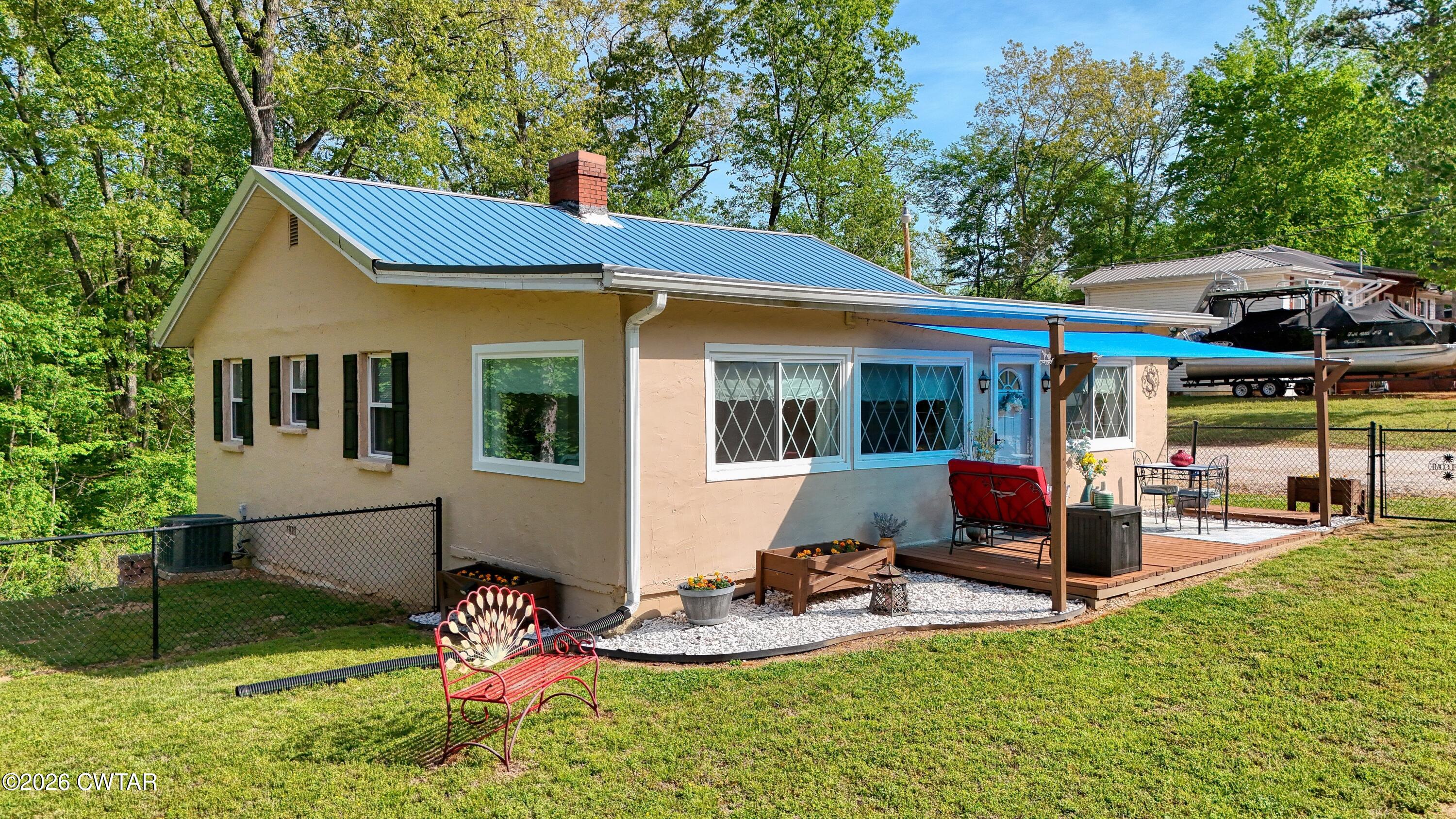 195 Coast Guard Road Buchanan, TN 38222 - Photo 5 of 34 a view of a house with backyard porch and sitting area