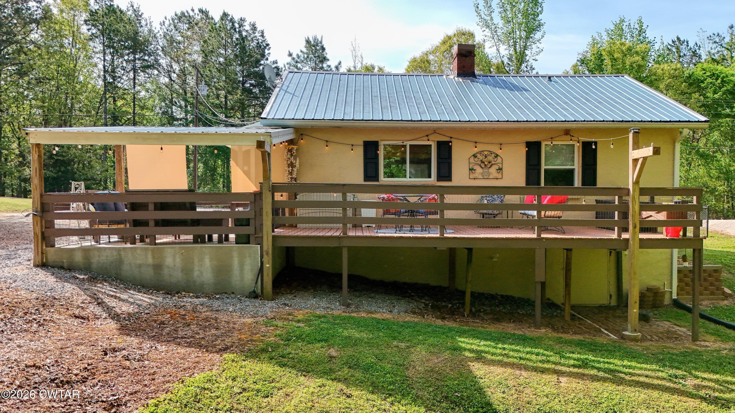 195 Coast Guard Road Buchanan, TN 38222 - Photo 6 of 34 a view of a house with a tub and a swimming pool