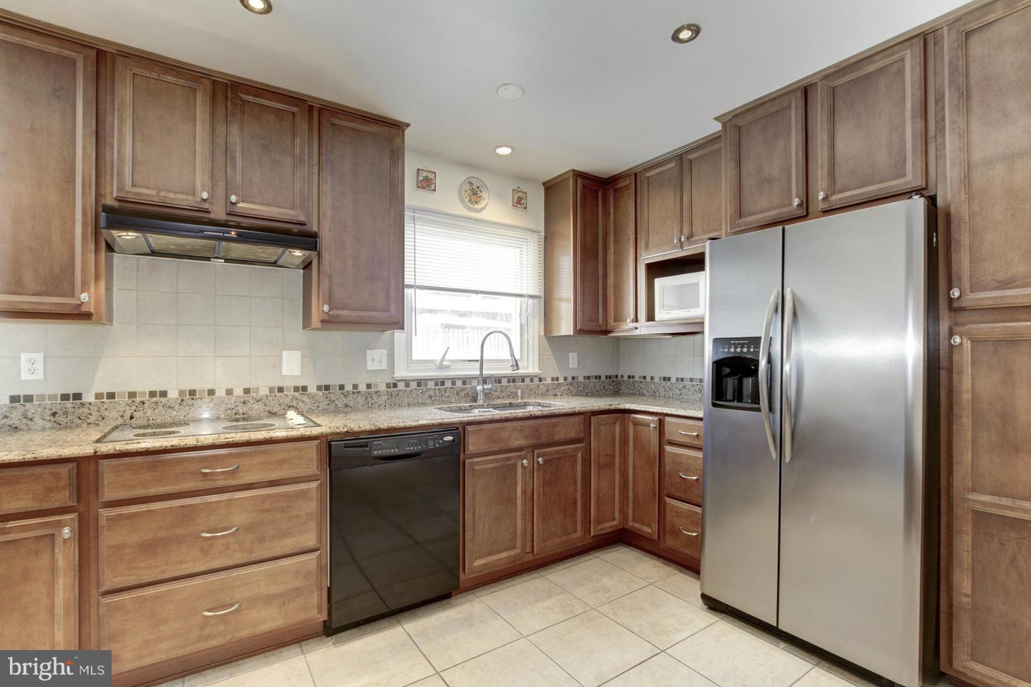 13308 Old Forge Road Silver Spring, MD 20904 - Photo 12 of 30 Inviting Kitchen with Tile Backsplash & Flooring