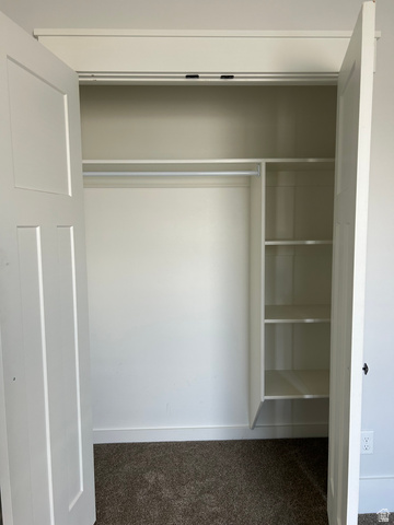 175 North 100th West Centerfield, UT 84622 - Photo 21 of 32 Recessed closet featuring bi-fold doors, integrated shelving, and a hanging rod in bedroom
