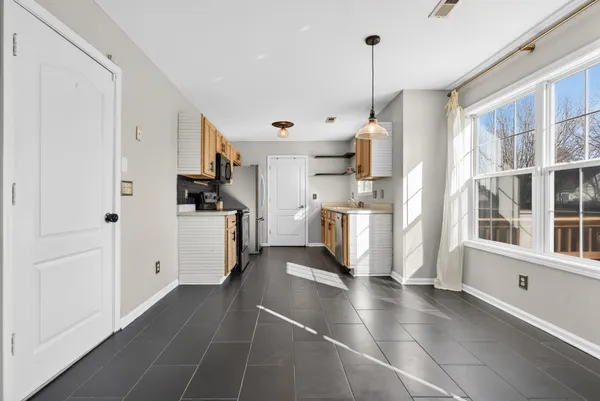 a kitchen with stainless steel appliances a refrigerator sink and cabinets