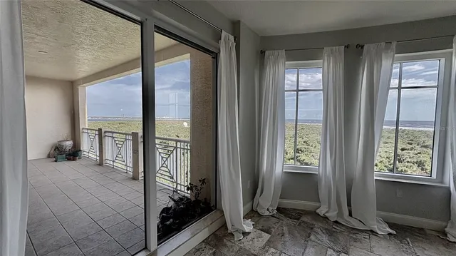 a view of an entryway and livingroom