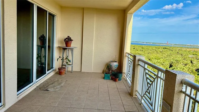 a view of a big room with wooden floor and a bathroom