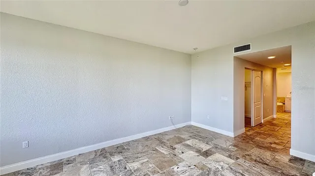 a bathroom with a bathtub sink mirror and toilet