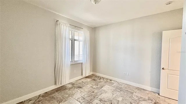 a bathroom with a shower and a sink