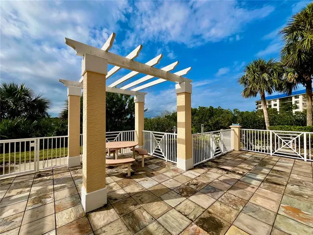 a view of a building with palm trees