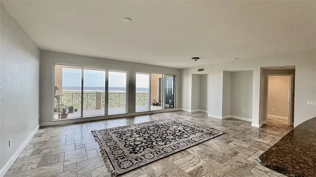 a kitchen with a refrigerator and a stove top oven