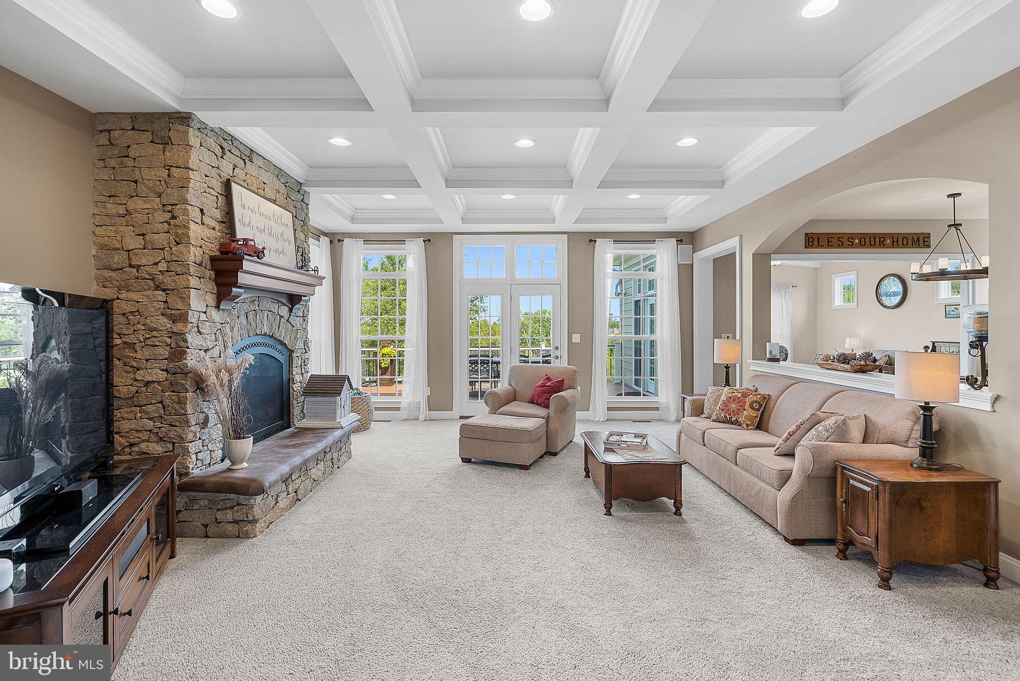 18604 Wild Raspberry Drive Purcellville, VA 20132 - Photo 2 of 44 Family room with stone gas fireplace