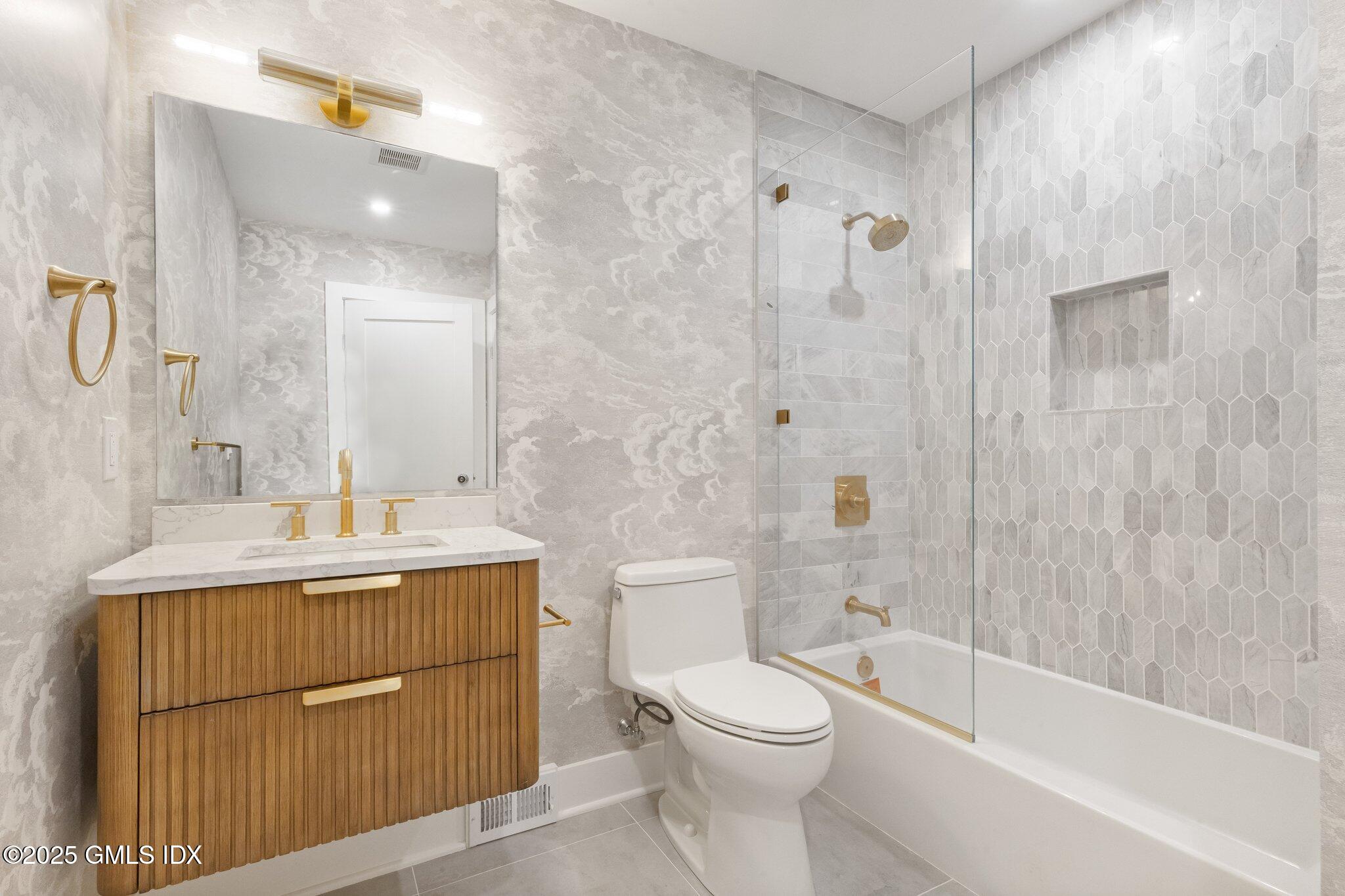 8 Pintail Lane Greenwich, CT 06830 - Photo 13 of 37 a bathroom with a sink a toilet and shower