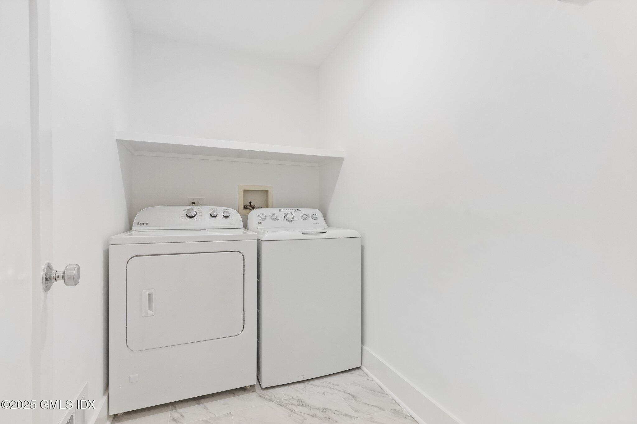 8 Pintail Lane Greenwich, CT 06830 - Photo 14 of 37 a utility room with dryer and washer