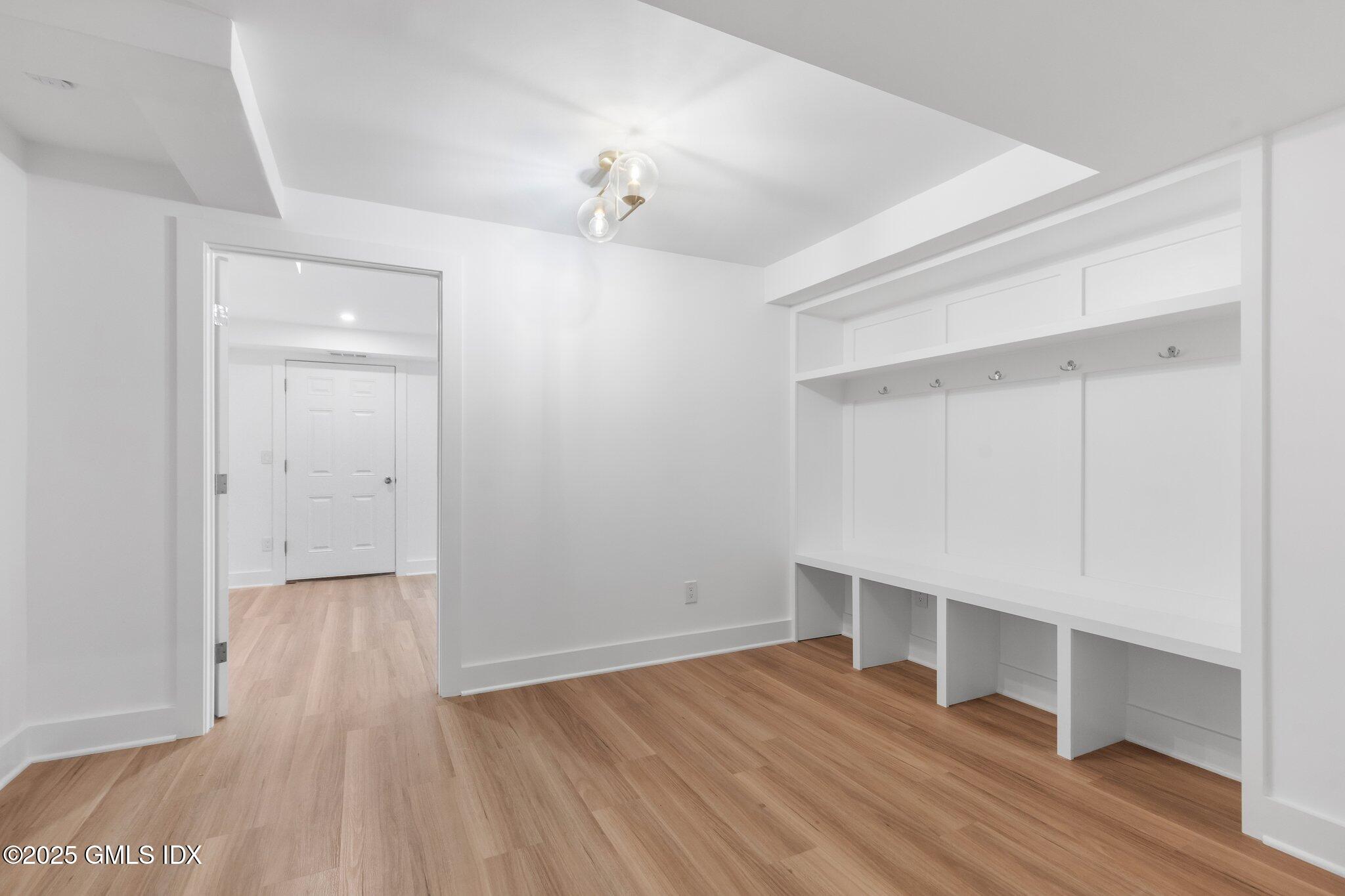 8 Pintail Lane Greenwich, CT 06830 - Photo 24 of 37 wooden floor in an empty room with a window
