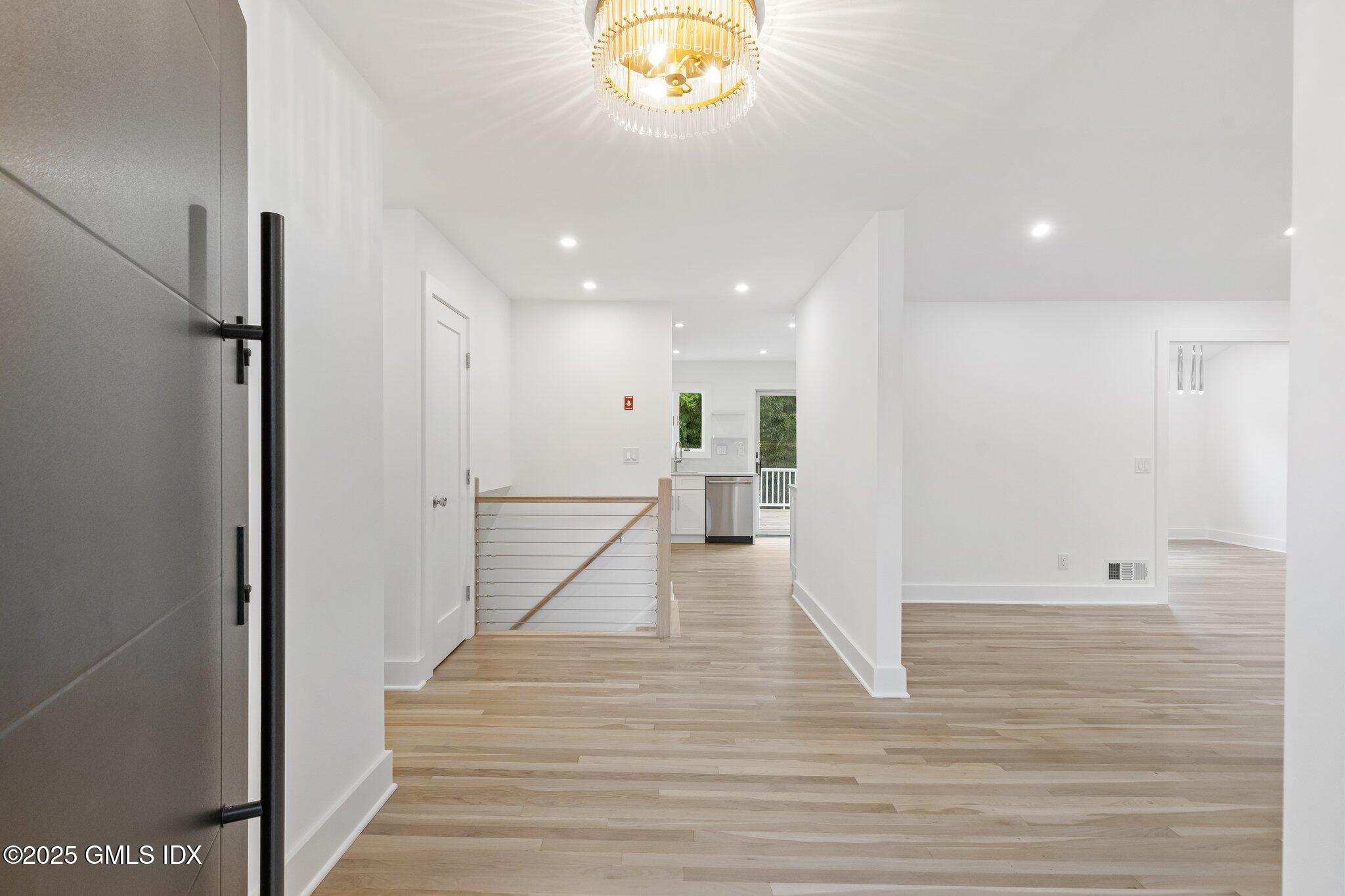 8 Pintail Lane Greenwich, CT 06830 - Photo 3 of 37 a view of an entryway with wooden floor