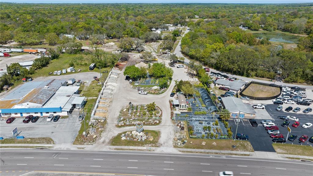 11637 State Road 52 Port Richey, FL 34669 - Photo 2 of 5 an aerial view of residential houses with outdoor space