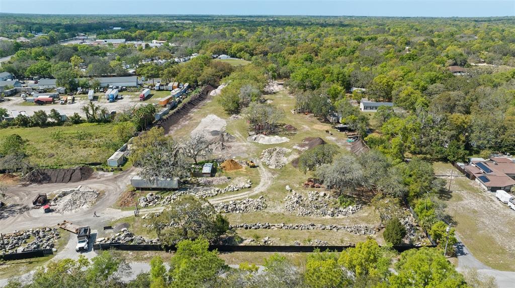 11637 State Road 52 Port Richey, FL 34669 - Photo 4 of 5 an aerial view of a houses with a yard