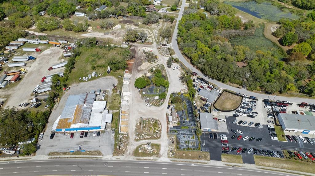 11637 State Road 52 Port Richey, FL 34669 - Photo 5 of 5 an aerial view of residential house with outdoor space and parking