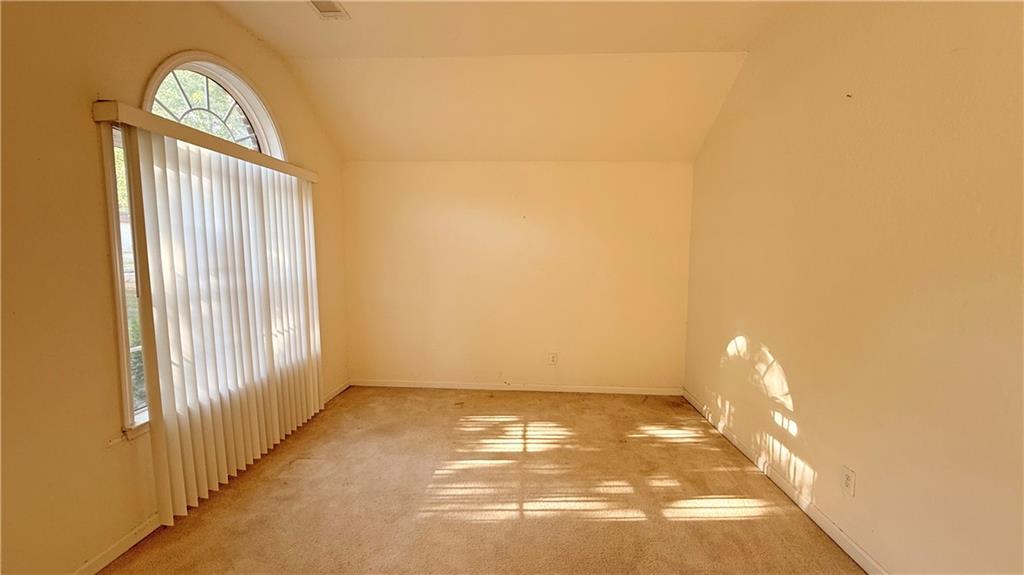 65 Lakeridge Court Covington, GA 30016 - Photo 6 of 17 a view of empty room with windows
