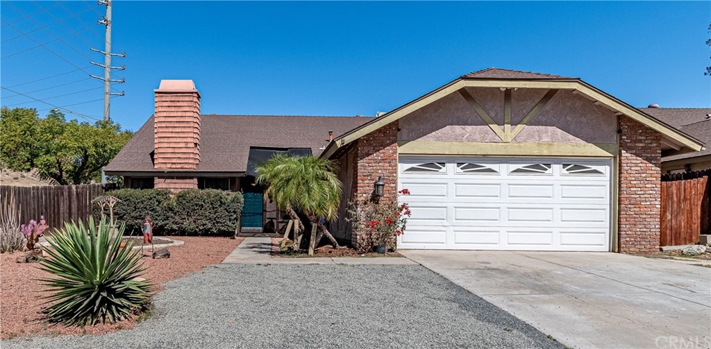 10131 Keegan Court Riverside, CA 92503 - Photo 1 of 1 a front view of a house with a yard