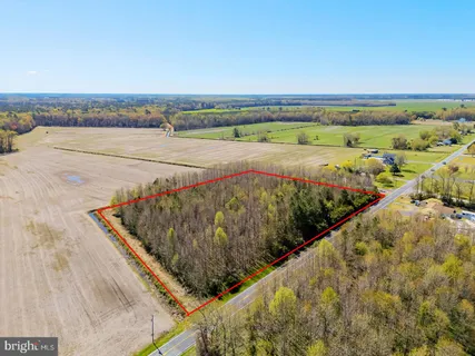 an aerial view of residential building and ocean view