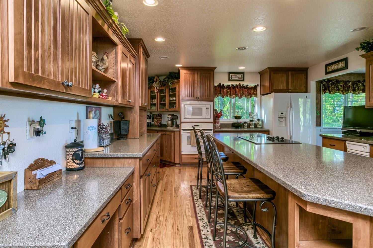 4110 Old Stage Road Central Point, OR 97502 - Photo 10 of 34 a kitchen with stainless steel appliances granite countertop counter space a sink and cabinets