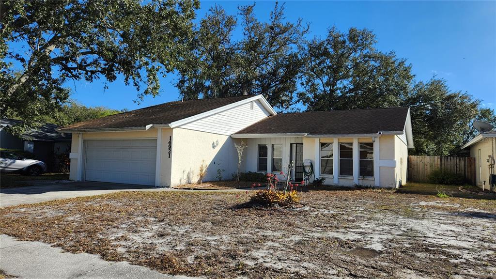 14921 Old Pointe Road Tampa, FL 33613 - Photo 1 of 32 front view of a house with a yard