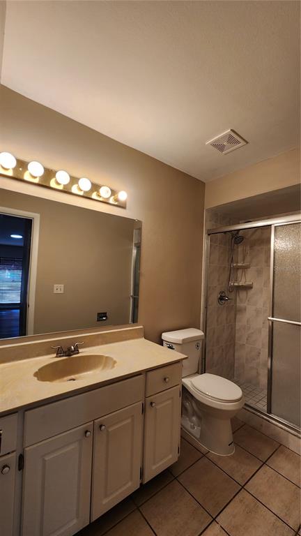 14921 Old Pointe Road Tampa, FL 33613 - Photo 16 of 32 a bathroom with a double vanity sink mirror and toilet