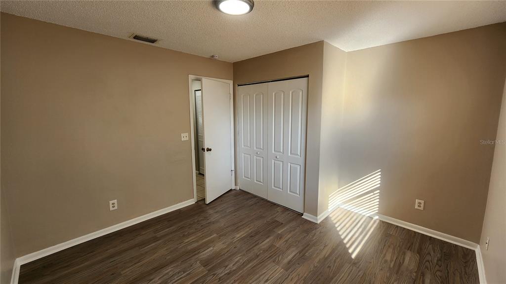14921 Old Pointe Road Tampa, FL 33613 - Photo 20 of 32 a view of hallway with wooden floor