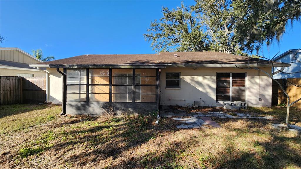 14921 Old Pointe Road Tampa, FL 33613 - Photo 29 of 32 a front view of a house with a garden