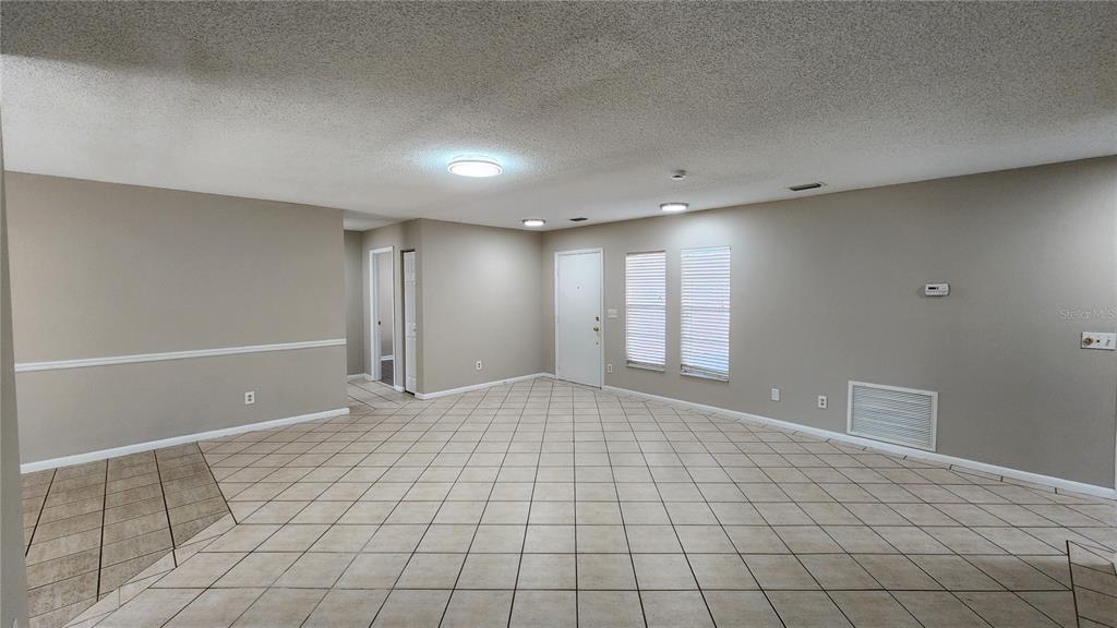 14921 Old Pointe Road Tampa, FL 33613 - Photo 6 of 32 a view of an empty room