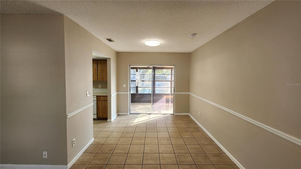 14921 Old Pointe Road Tampa, FL 33613 - Photo 7 of 32 a view of an empty room with a window