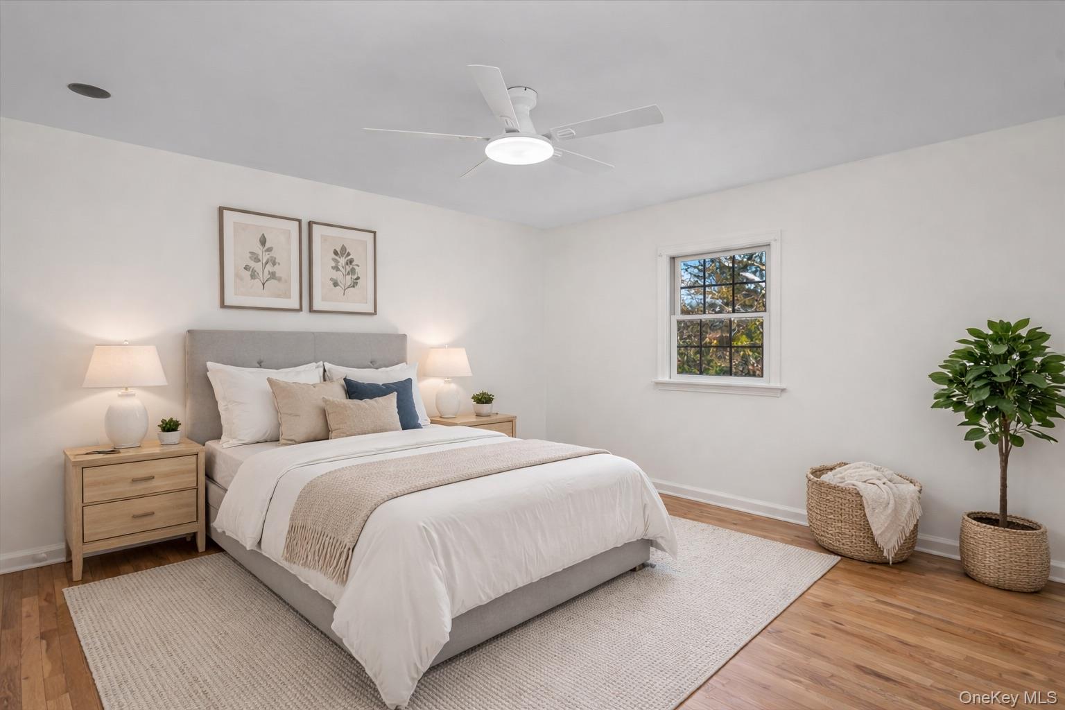115 Coolidge Avenue Rye, NY 10580 - Photo 16 of 30 a bedroom with a bed and a potted plant