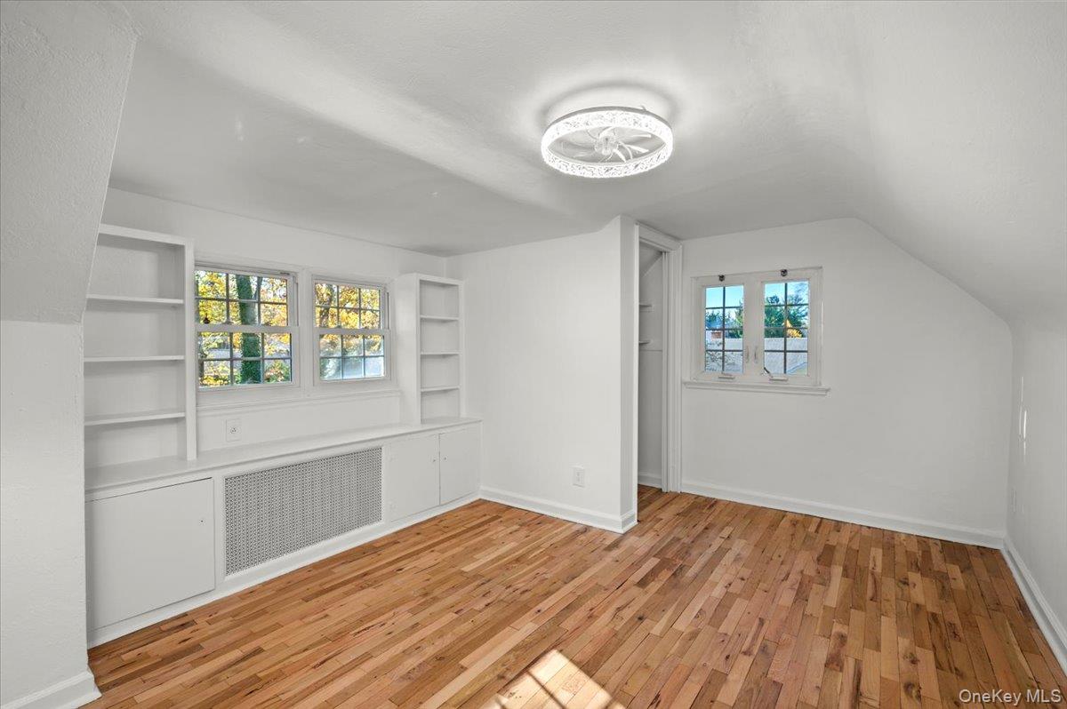 115 Coolidge Avenue Rye, NY 10580 - Photo 16 of 27 a view of empty room with wooden floor and fan