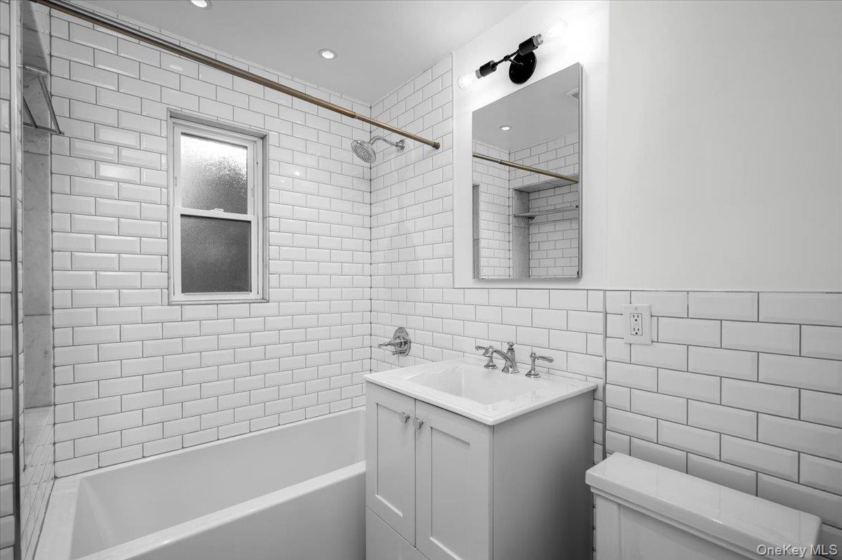 115 Coolidge Avenue Rye, NY 10580 - Photo 17 of 30 a bathroom with a sink a toilet and shower