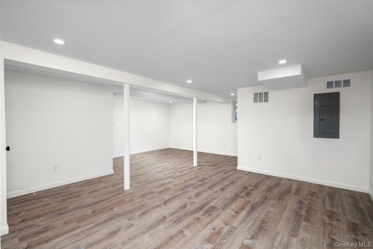 115 Coolidge Avenue Rye, NY 10580 - Photo 19 of 27 a view of an empty room with wooden floor