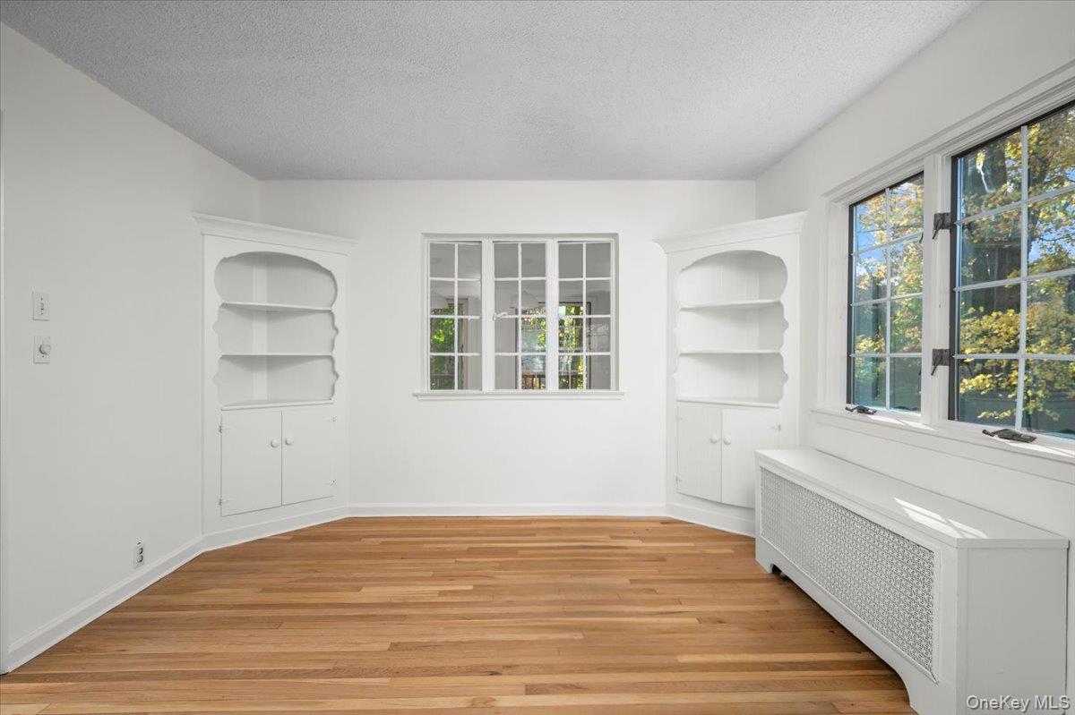 115 Coolidge Avenue Rye, NY 10580 - Photo 6 of 27 a view of empty room with wooden floor and fan