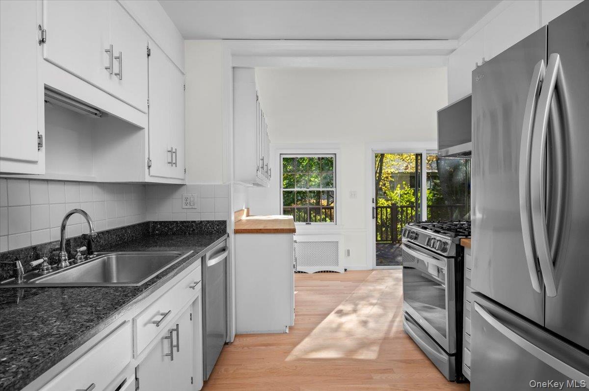 115 Coolidge Avenue Rye, NY 10580 - Photo 9 of 27 a kitchen with stainless steel appliances granite countertop a sink stove and refrigerator