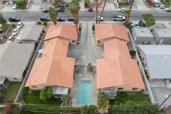 an aerial view of residential houses with outdoor space