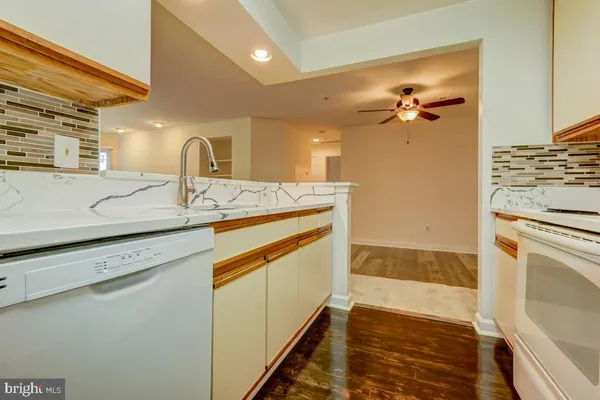 a view of a kitchen with a sink and dishwasher