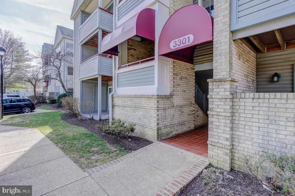 a view of a brick building with many windows