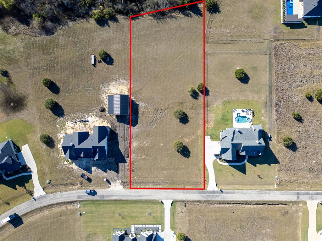 6335 Rigel Road Godley, TX 76044 - Photo 1 of 6 an aerial view of residential houses with outdoor space