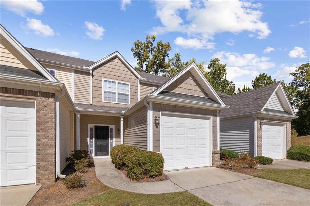 1558 Paramount View Trace Northeast Sugar Hill, GA 30518 - Photo 1 of 21 a view of a house with a yard and potted plants