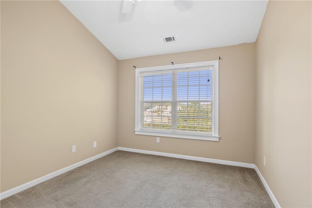 1558 Paramount View Trace Northeast Sugar Hill, GA 30518 - Photo 14 of 21 an empty room with a window