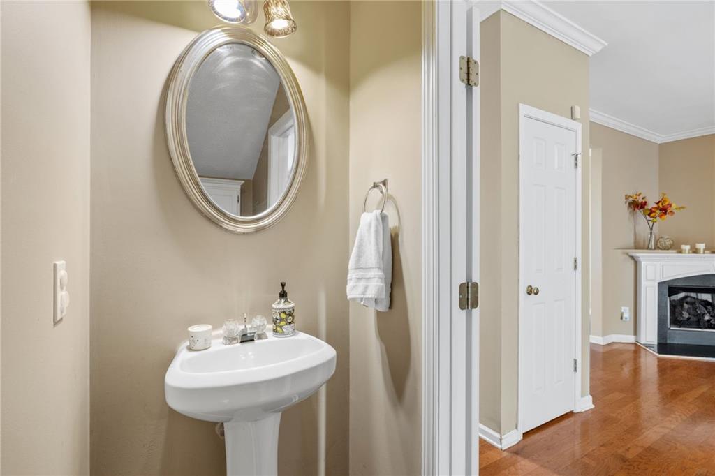 1558 Paramount View Trace Northeast Sugar Hill, GA 30518 - Photo 5 of 21 a bathroom with a sink and a mirror