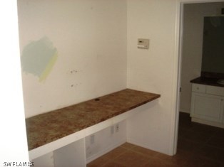 1409 Meadow Road Lehigh Acres, FL 33976 - Photo 4 of 12 a view of kitchen island