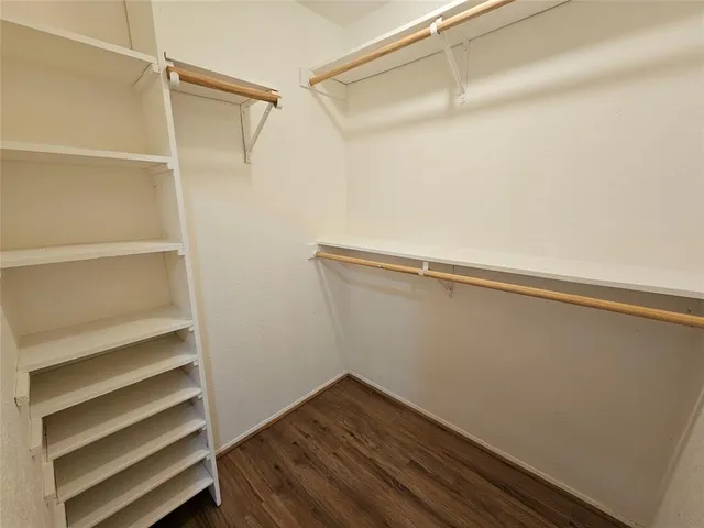 a view of an empty walk in closet