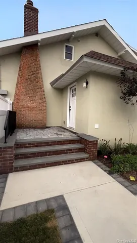 a view of entryway with a fireplace