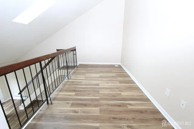a kitchen with sink stove and refrigerator