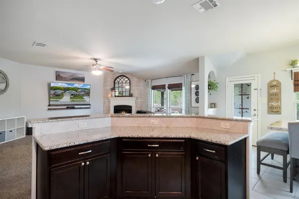 a view of a chairs and backyard