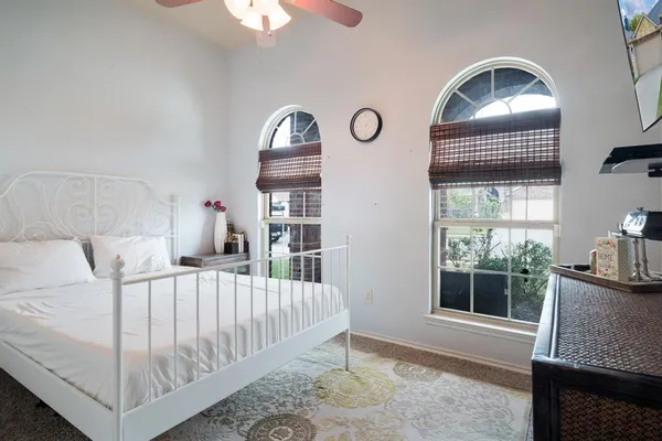 a en suite bathroom with a sink and a mirror